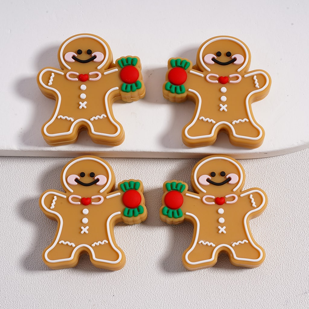 Christmas Gingerbread Man design silicone focal beads holding a candy cane