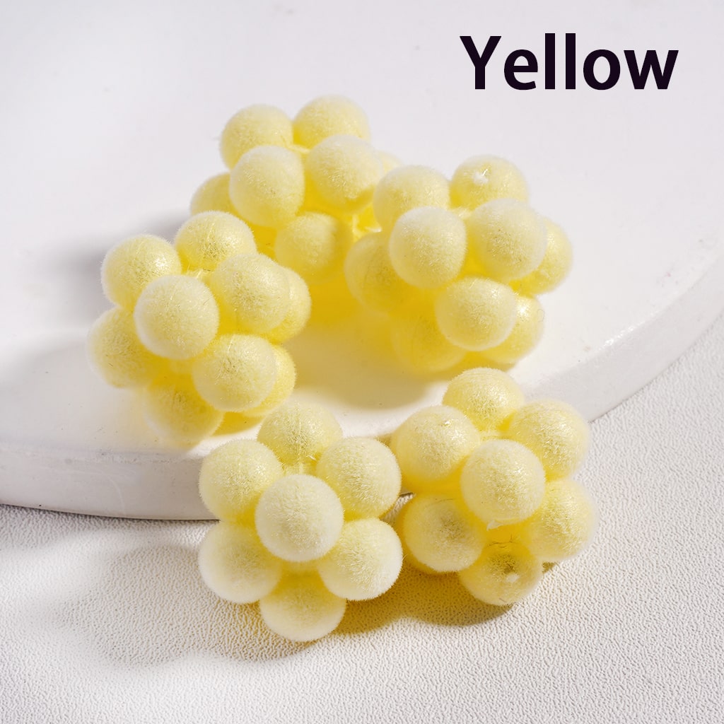 Yellow grape-shaped bath bombs on a white surface with 'Yellow' text above.

