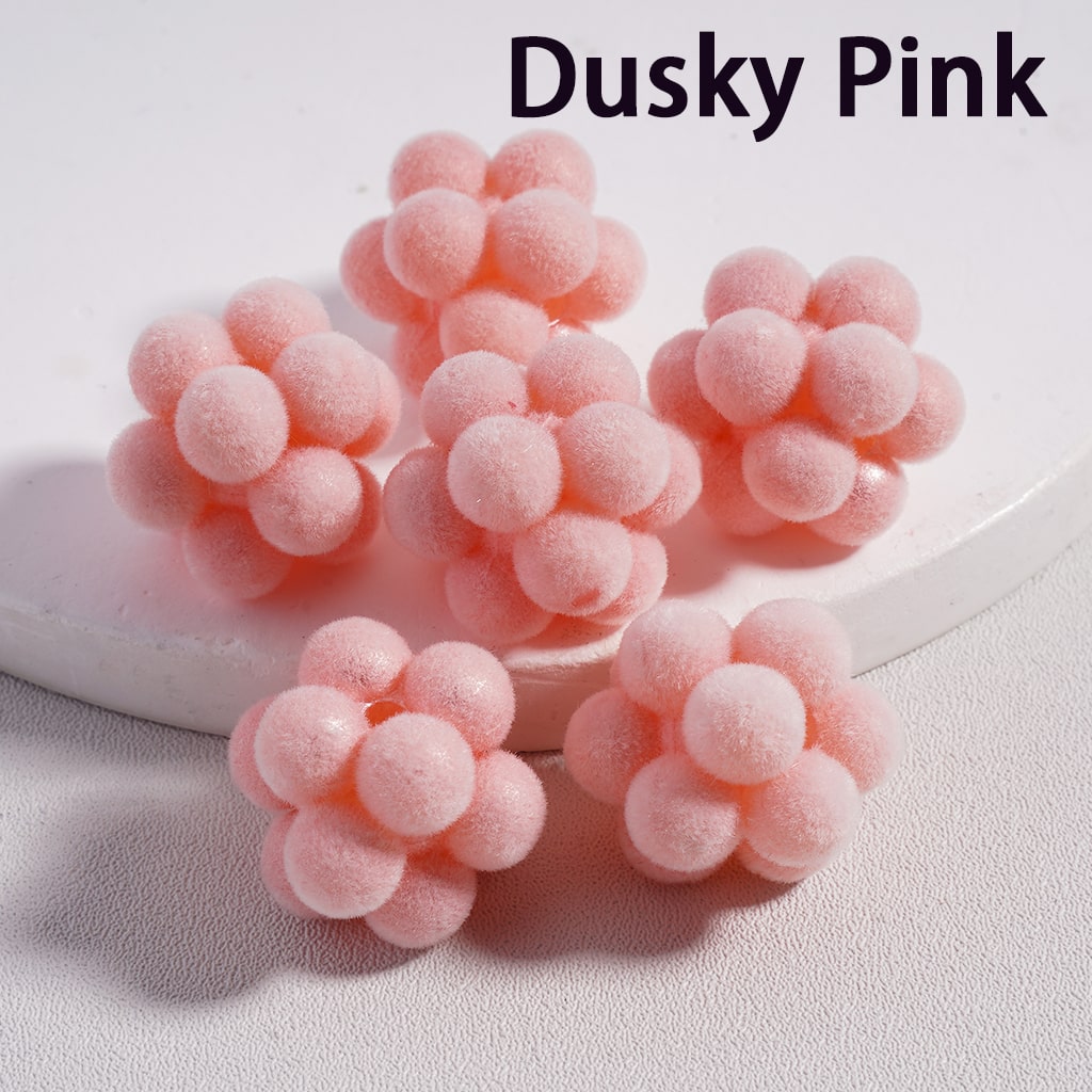 Pink fuzzy balls on a white background with 'Dusky Pink' text.

