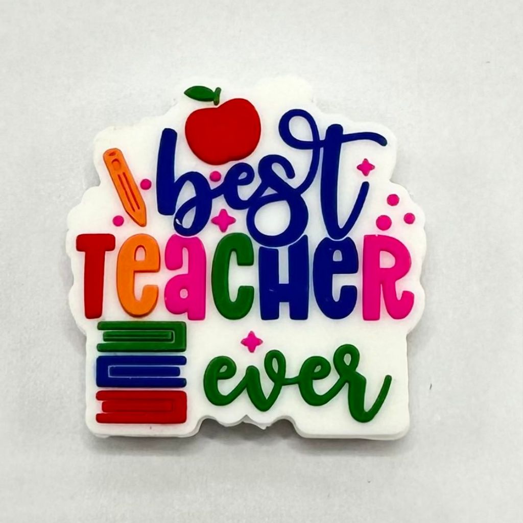 A colorful silicone bead with the text 'Best Teacher Ever' and an apple and books design.

