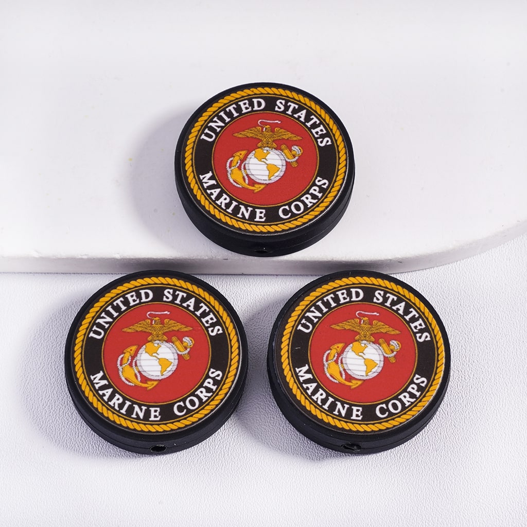 Three United States Marine Corps logo coasters on a white background