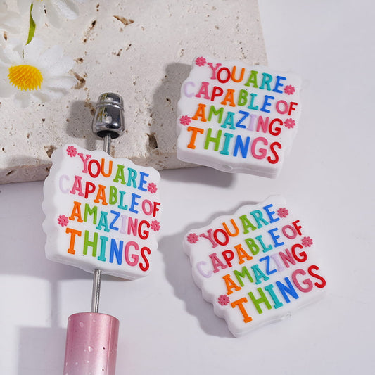 White Silicone Focal Beads with Text "YOU ARE CAPABLE OF AMAZING THINGS" and Pink Flowers