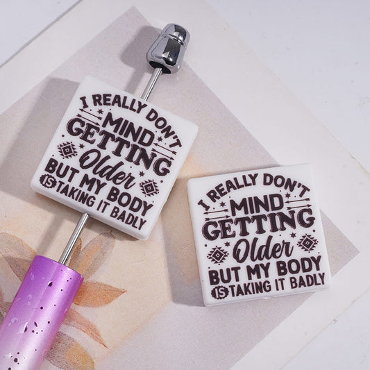 Text "I REALLY DON'T MIND GETTING Older BUT MY BODY IS TAKING IT BADLY",Silicone Focal Beads, Flat Square Shape