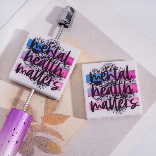 Blue Purple Pink Ombre Color Stripes Flowers Background on Text "mental health matters" Flat Square Shape Silicone Focal Beads