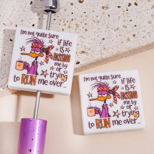 Purple Duck Holding Coffee Cup with Text "I'm not quite sure if life is PASSING me by or trying to RUN me over...",  Flat Square Shape Silicone Focal Beads