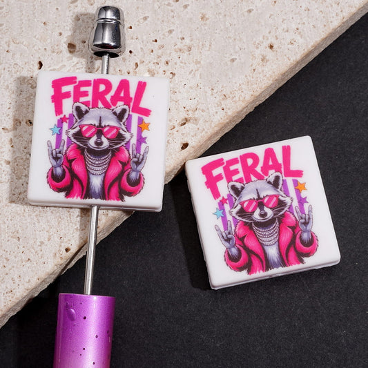 Classy Cartoon Raccoon with FERAL Text, Pink Jacket and Rock and Roll Hand Sign Flat Square Shape Silicone Focal Beads