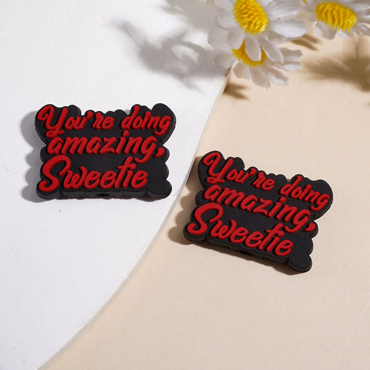 Black Silicone Focal Beads with Red Text "You're Doing Amazing, Sweetie"
