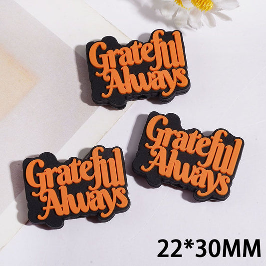 Inspirational “Grateful Always” Orange Text Silicone Focal Bead on Black Background, 22*30MM