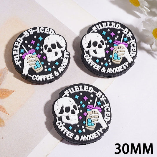 Spooky Skull Holding Coffee with Text "FUELED BY ICED COFFEE & ANXIETY" Flat Round Shape Silicone Focal Bead, 30MM