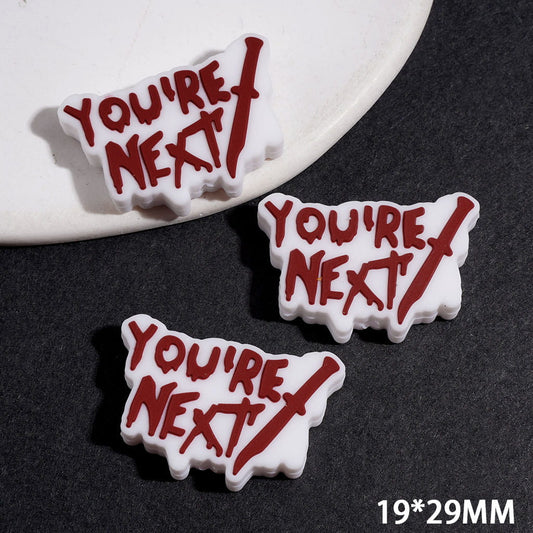 Spooky Dark Red-Brown Knife with “YOU’RE NEXT” Text on White Background Silicone Focal Beads