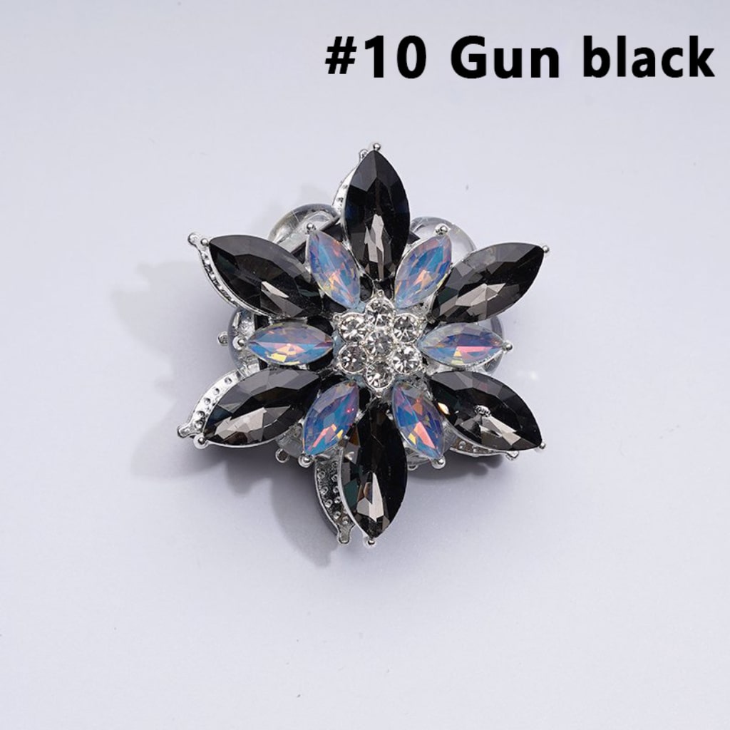 A collection of silver alloy six-petaled flowers with clear and colorful rhinestones and clay beads.

