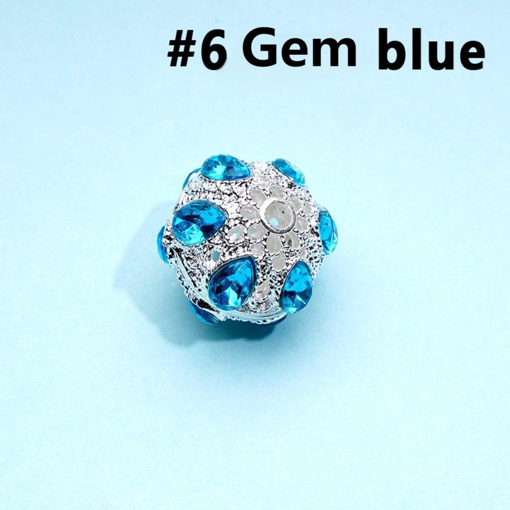 A collection of silver alloy beads with colorful rhinestones, approximately 16mm in size, displayed on a blue background.

