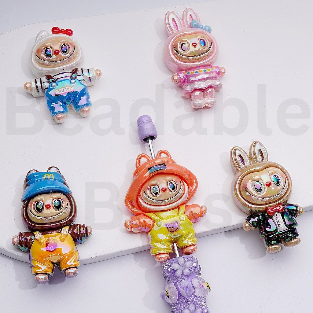 Colorful cartoon character figurines on a white background

