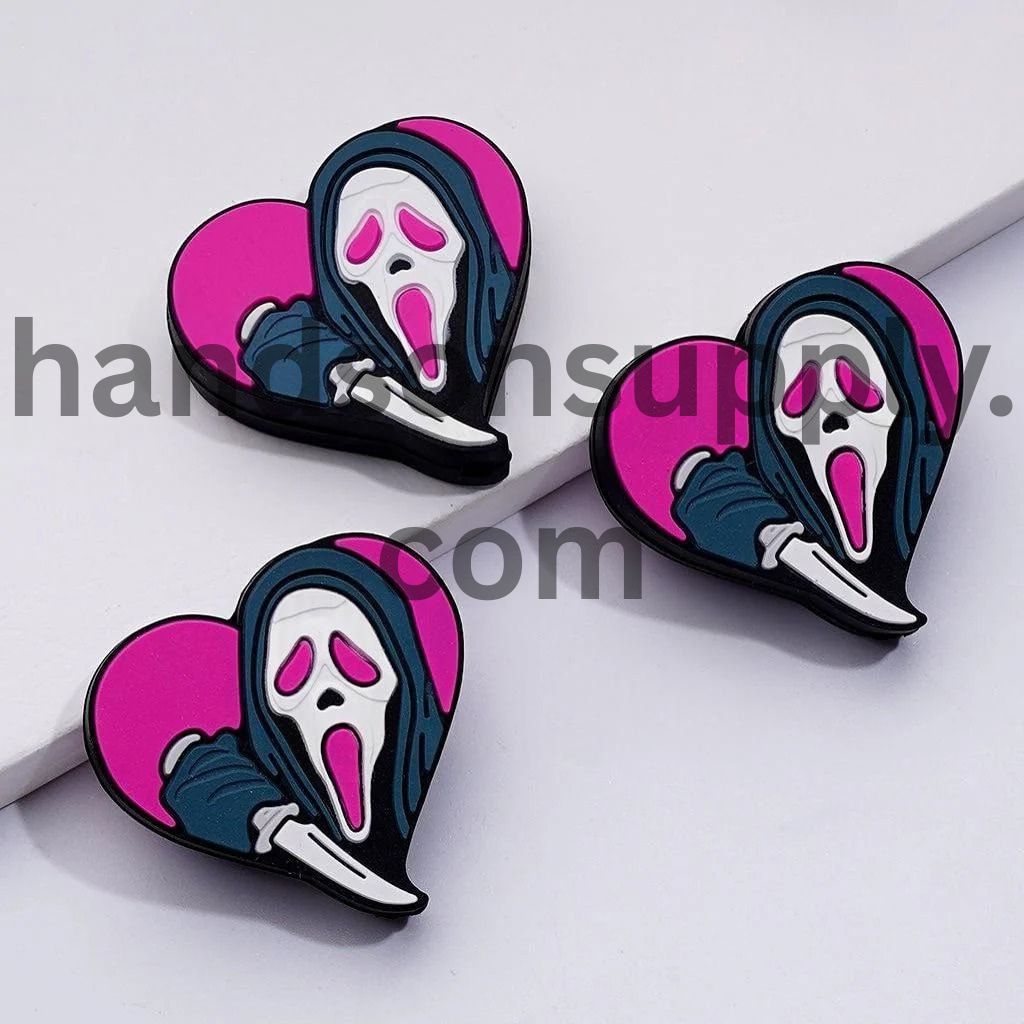 Adorable Haunted Phantom Holds a Cutter Red Heart Silicone Focal Beads