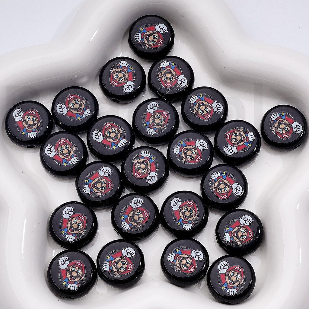 Collection of black buttons with cartoon character design on a white surface

