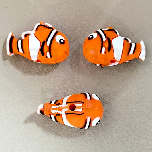 Three silicone beads designed to resemble clownfish from the animated movie 'Finding Nemo'.

