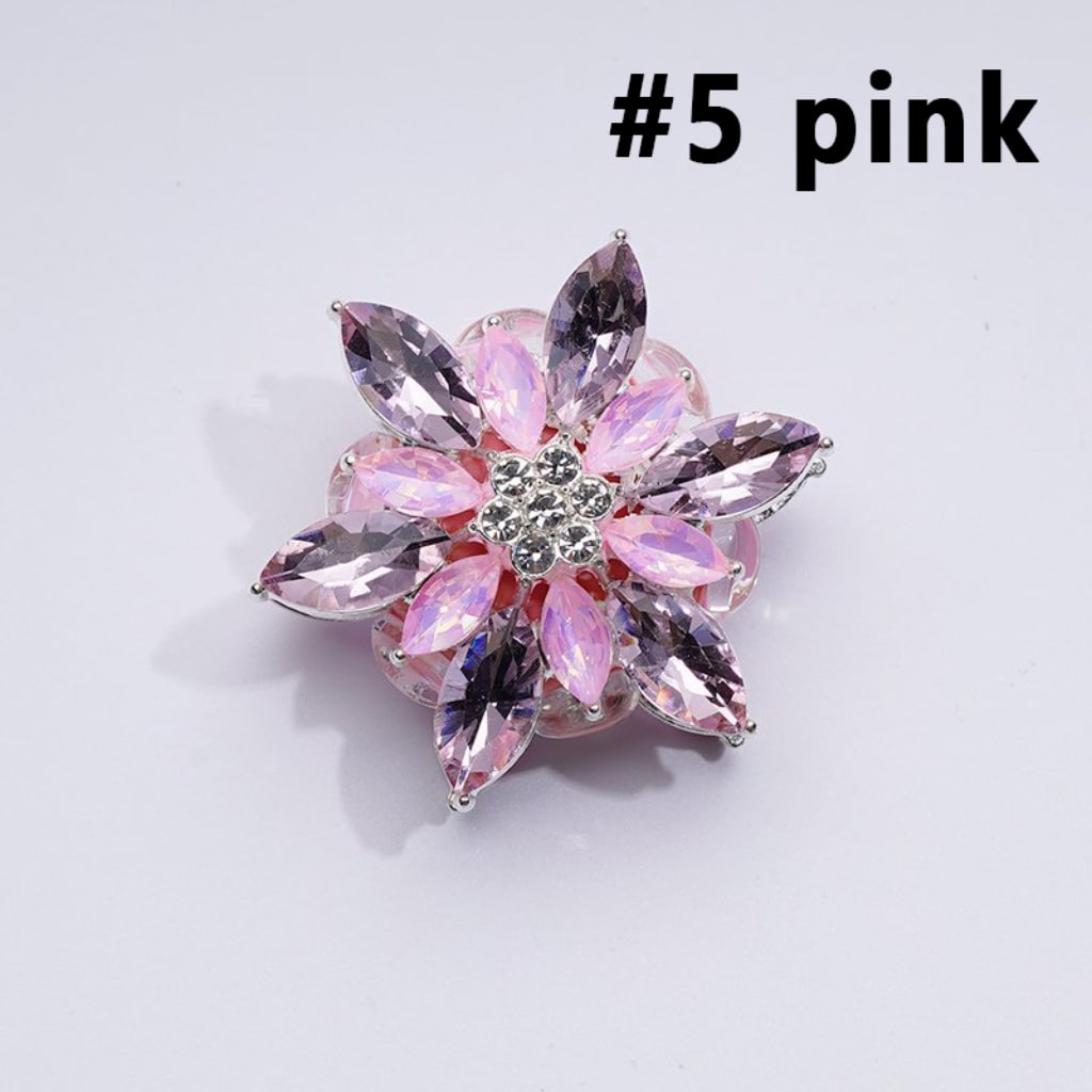 A collection of silver alloy six-petaled flowers with clear and colorful rhinestones and clay beads.

