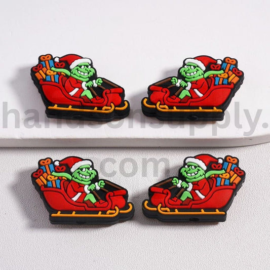 The Cute Green character with Red Christmas Hat Drives the Sledding Silicone Focal Beads
