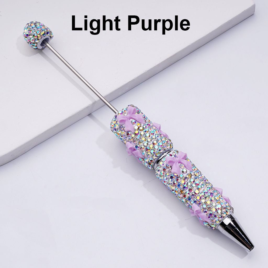 Decorative pen with light purple glittery accents on a white background


