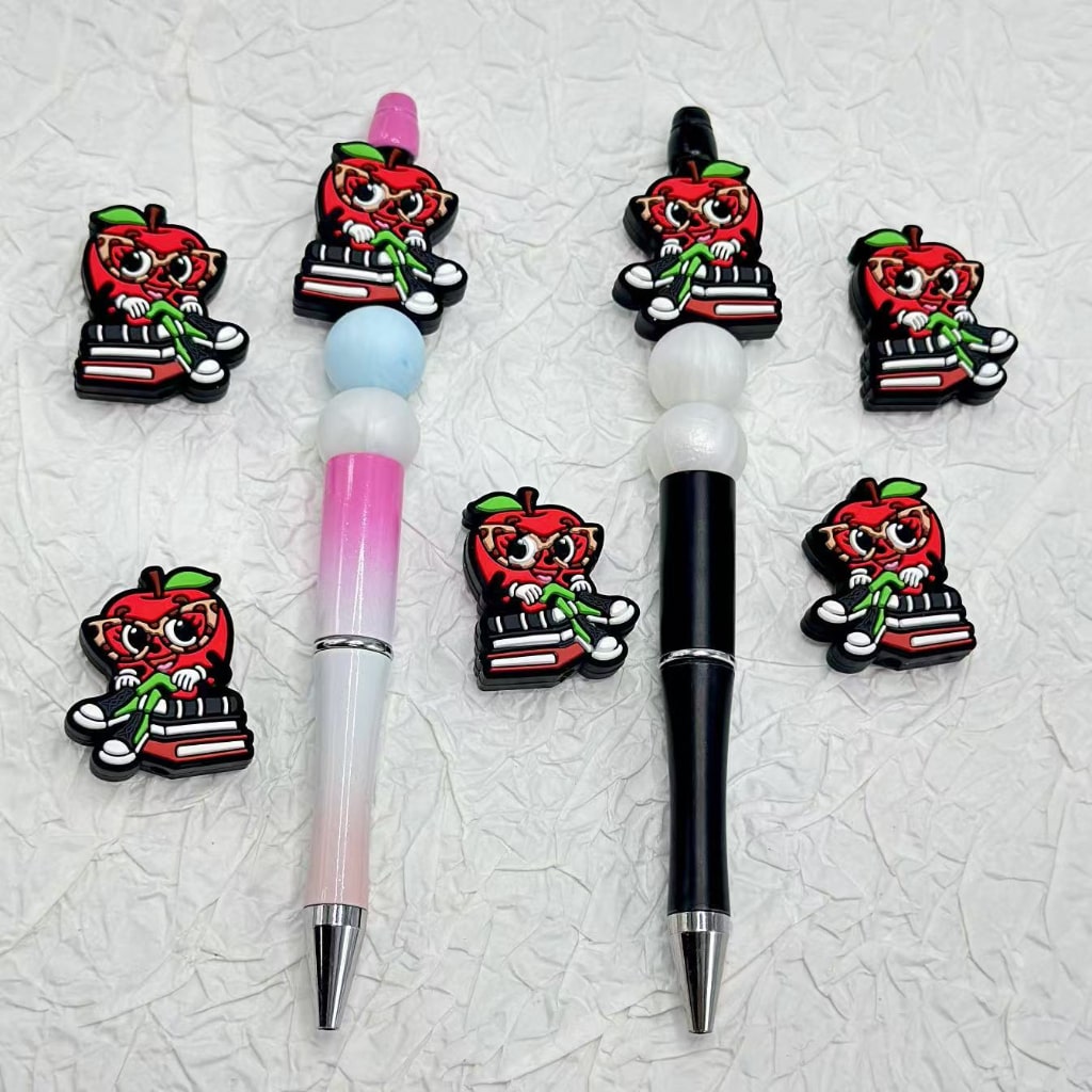 A Red Cute Apple Man in Glasses Sits on the Books Silicone Focal Beads