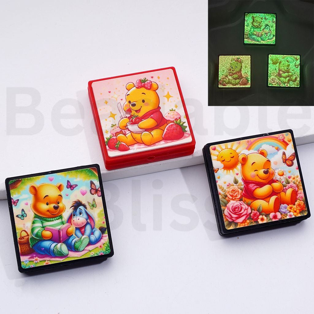 Colorful Winnie the Pooh-themed items on a white surface with 'beadablebliss.com' branding.

