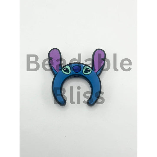 Blue and purple cartoon character headband on a white background

