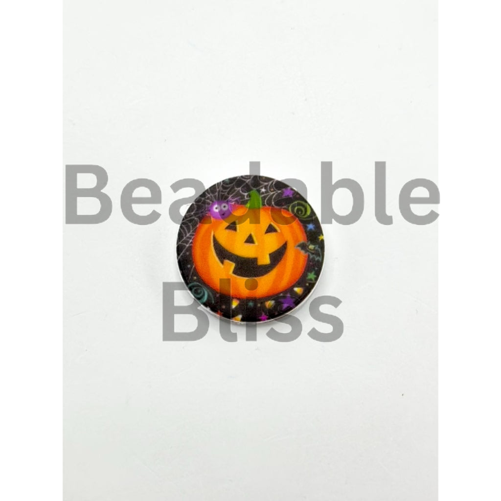 Halloween-themed button badge with a jack-o'-lantern design on a white background.


