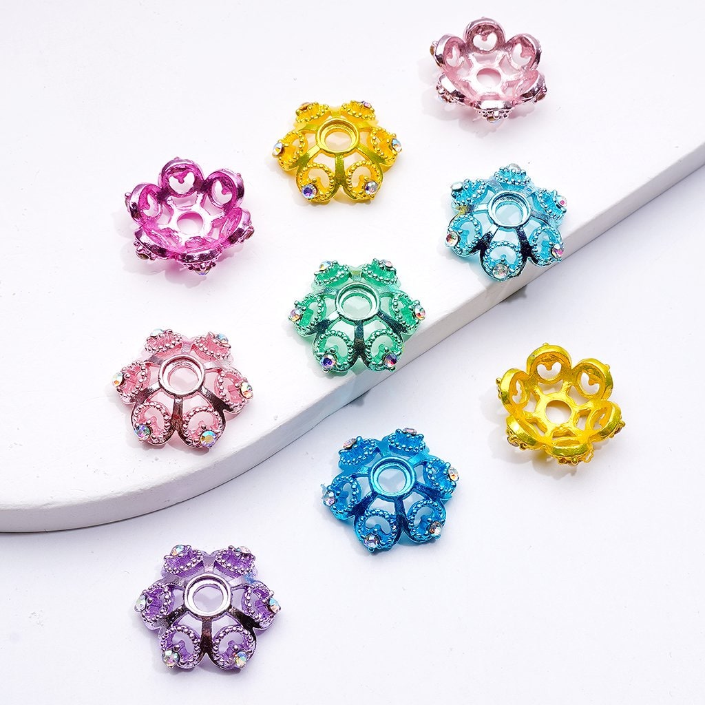 Colorful decorative beads on a white surface

