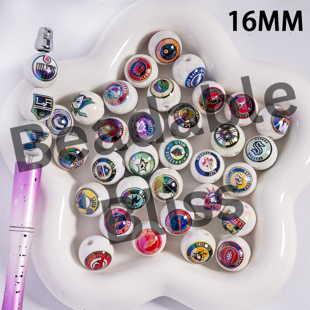 Collection of 16MM bead caps with various logos on a white tray.

